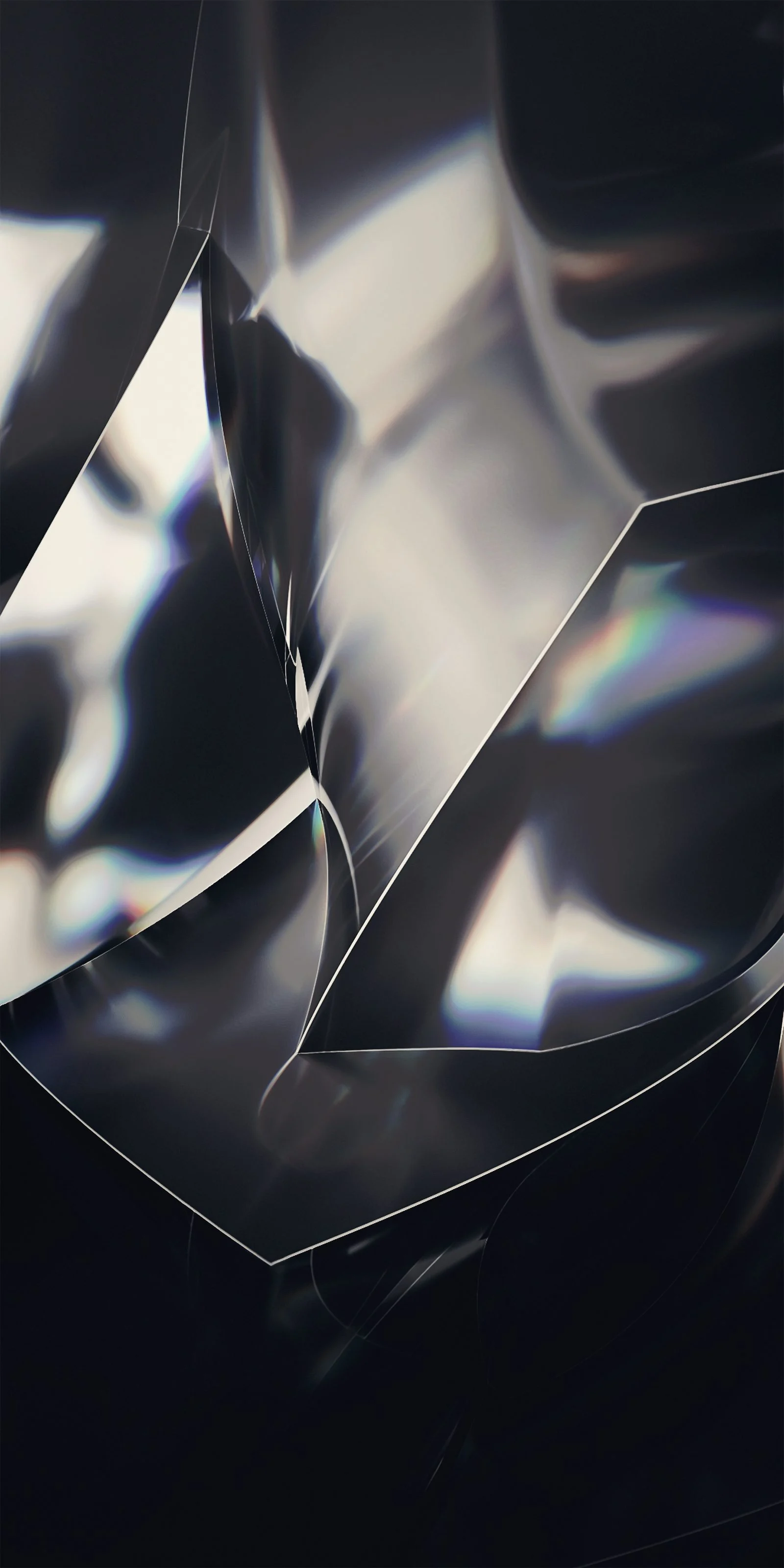 Faceted panes of dark glass folding into each other.