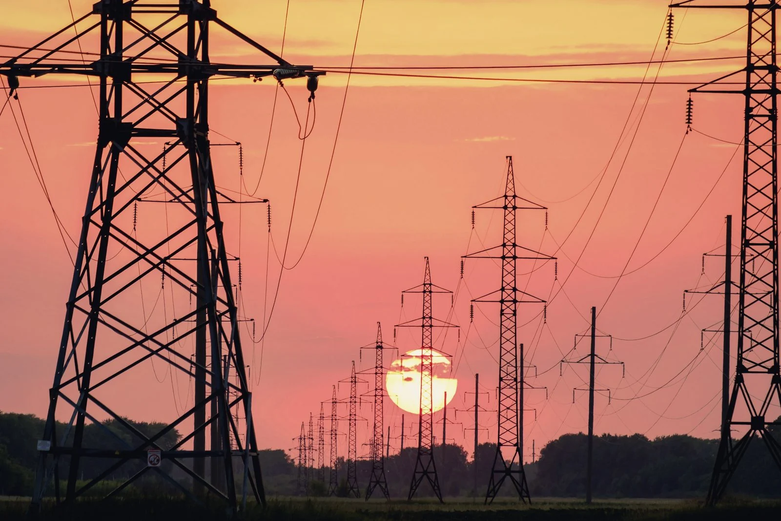 Transmission towers at dusk.